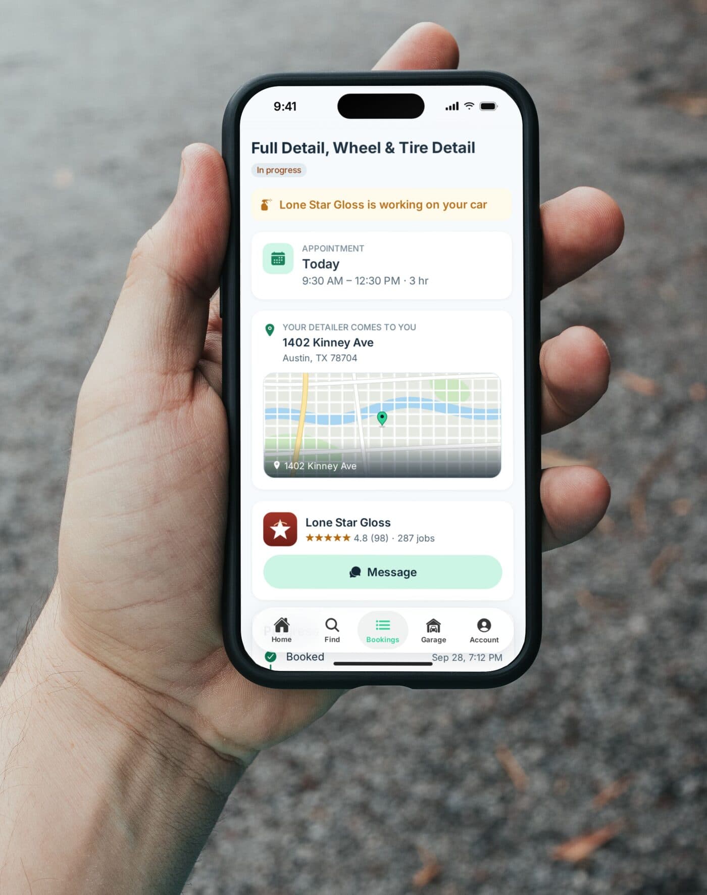 Someone on their driveway checking MotoMynt: Lone Star Gloss is working on their car, with today's appointment, the address, and a button to message the detailer